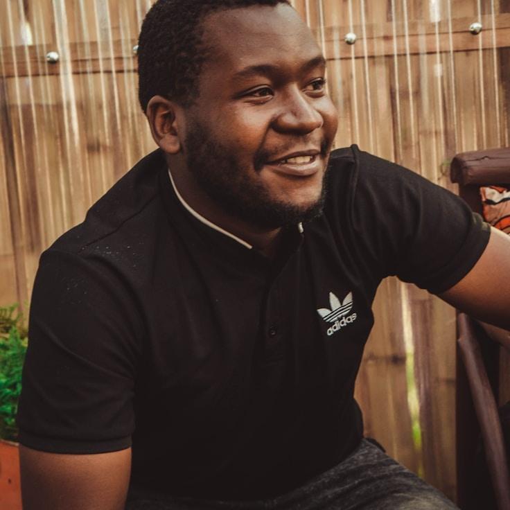 Avery Collins, Lead Design Curator at Cloud Harbor Zen, reviewing corporate floral arrangements